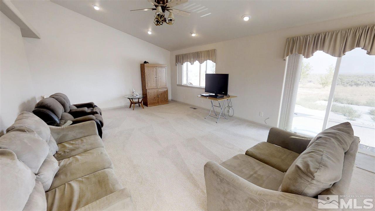 6080 Range Reno, NV 89510 - Photo 7 of 33 a living room with furniture and a flat screen tv