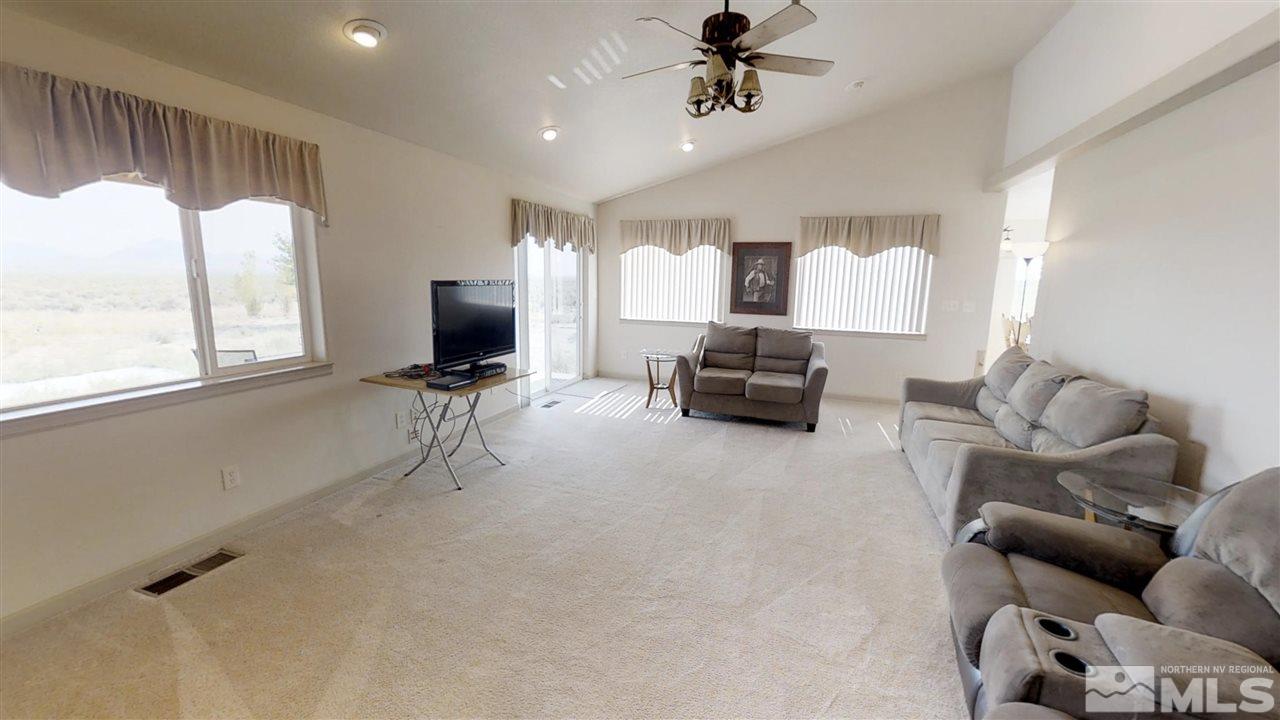 6080 Range Reno, NV 89510 - Photo 8 of 33 a living room with furniture and a flat screen tv