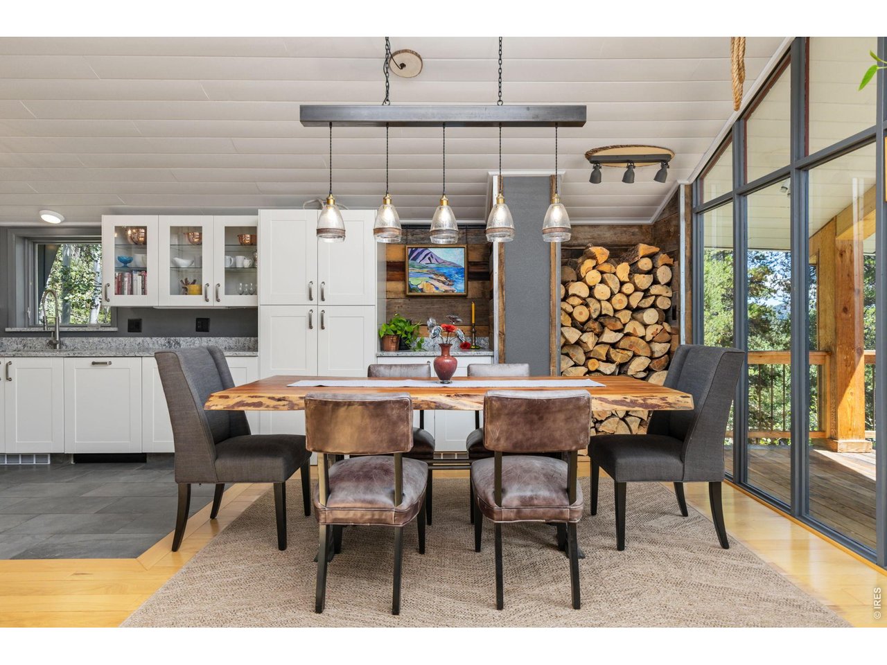 415 Upper Travis Gulch Road Black Hawk, CO 80422 - Photo 16 of 50 Barn wood accents are featured in the dining room