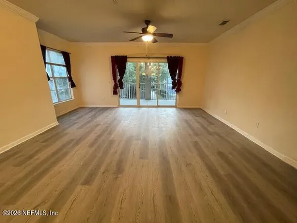 a view of a livingroom with wooden floor