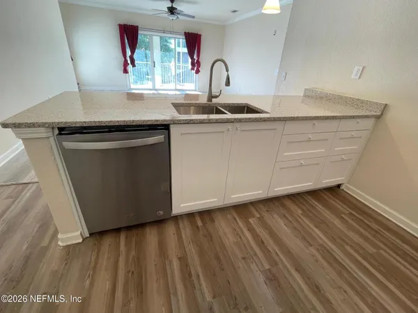 a kitchen with a sink and cabinets