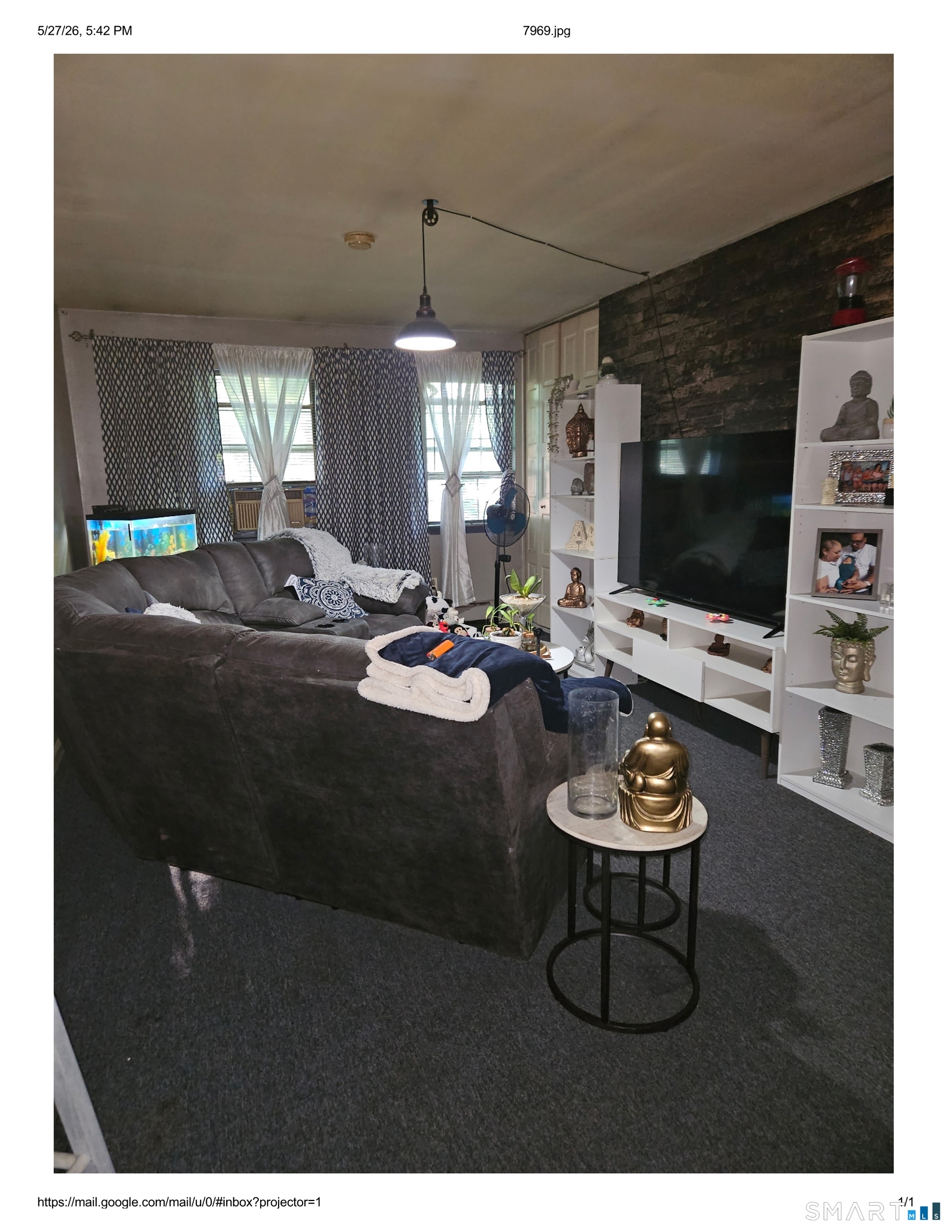 55 Angel Drive, Unit D Waterbury, CT 06708 - Photo 4 of 9 a living room with furniture a flat screen tv and a fireplace
