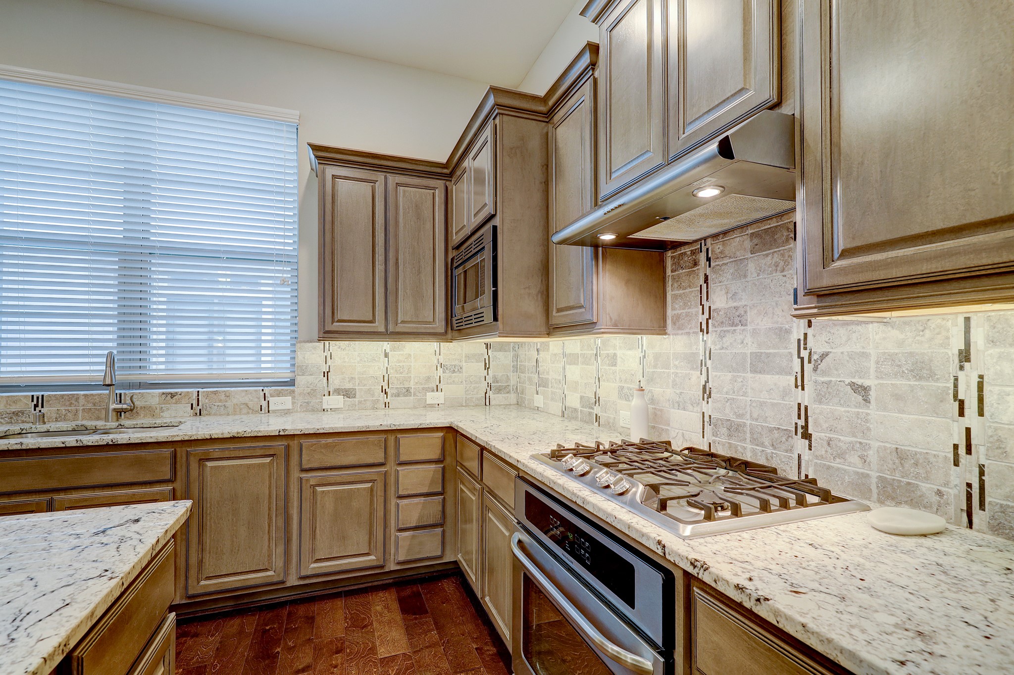 5453 Larkin Street Houston, TX 77007 - Photo 14 of 38 a kitchen with a stove and a sink
