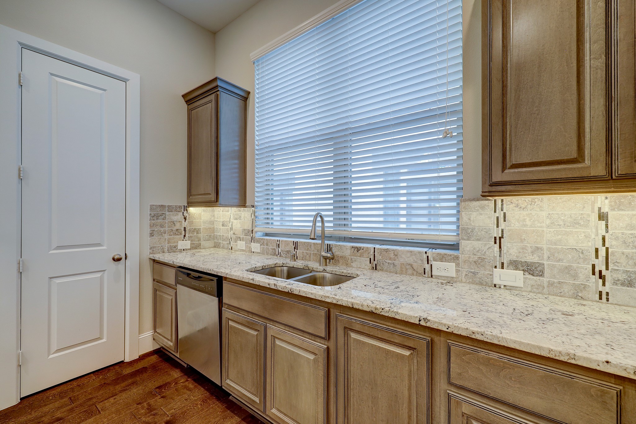5453 Larkin Street Houston, TX 77007 - Photo 15 of 38 a kitchen with a sink and cabinets