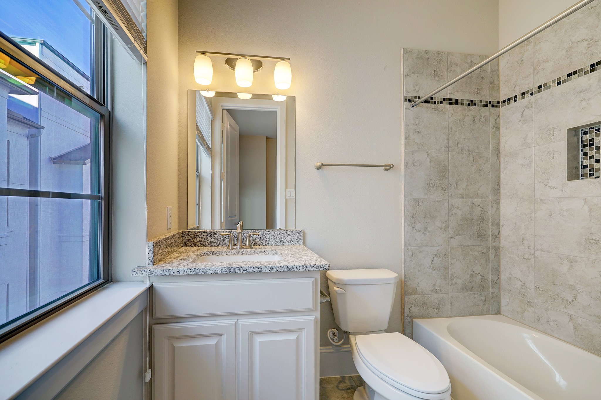 5453 Larkin Street Houston, TX 77007 - Photo 19 of 38 a bathroom with a granite countertop sink toilet and shower