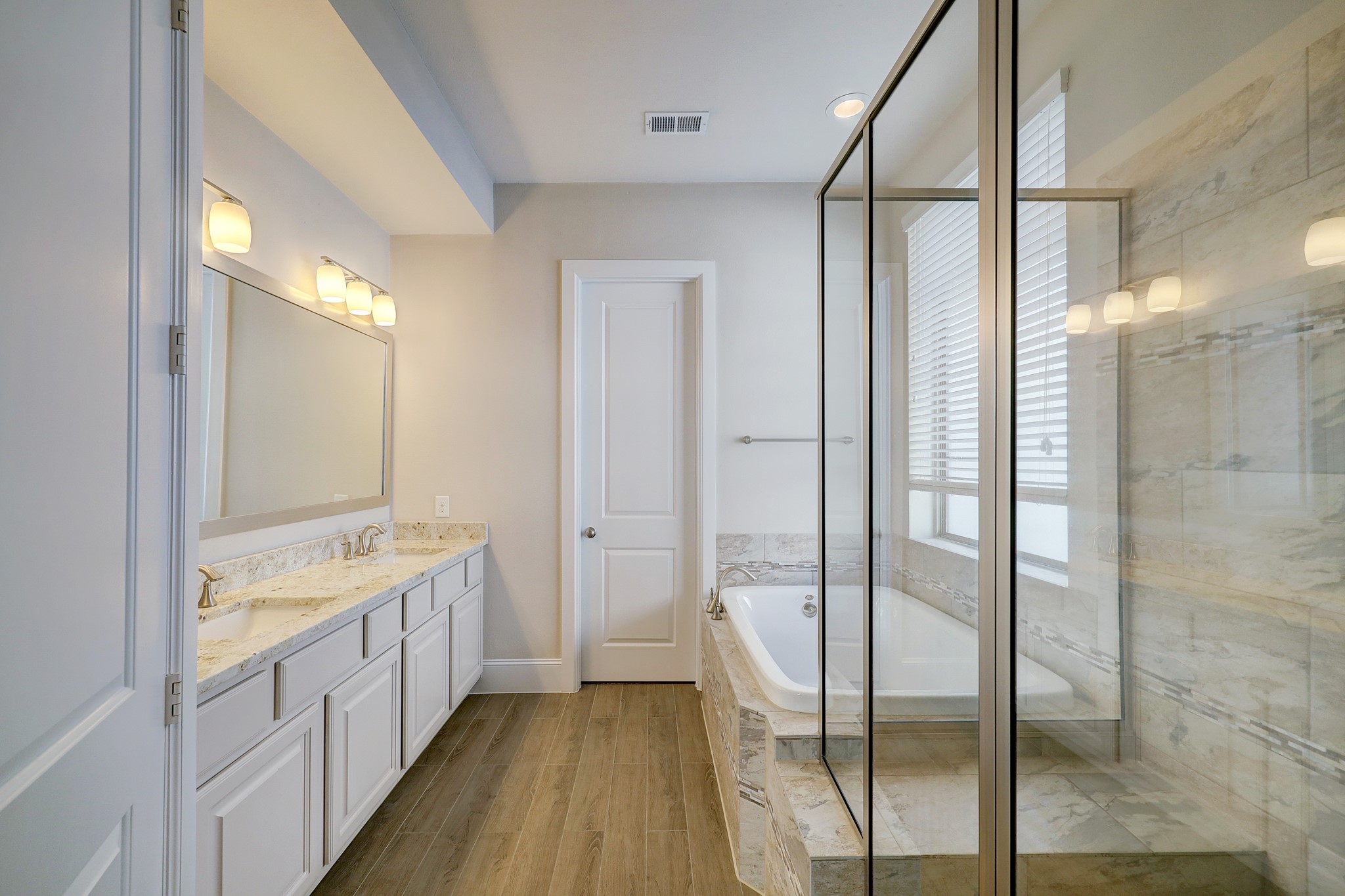 5453 Larkin Street Houston, TX 77007 - Photo 23 of 38 a bathroom with a double vanity sink and a mirror