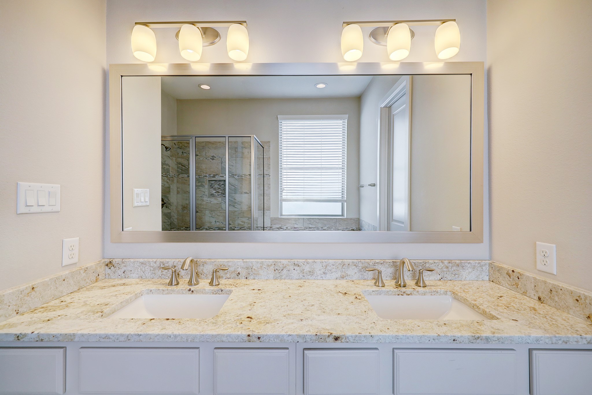 5453 Larkin Street Houston, TX 77007 - Photo 24 of 38 a bathroom with a granite countertop sink and a mirror
