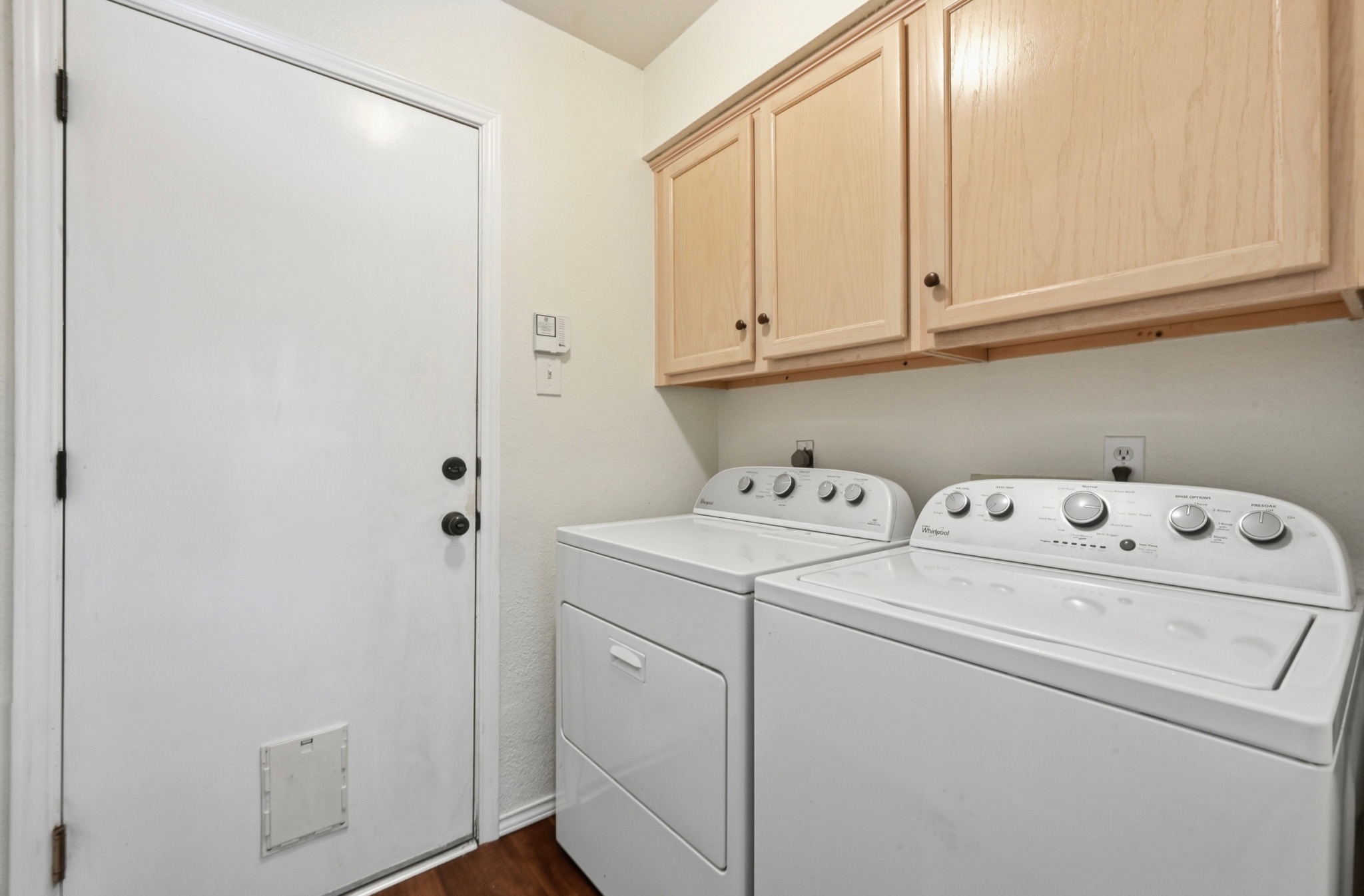 1409 Knoll Ridge Drive Cedar Park, TX 78613 - Photo 23 of 30 Functional laundry space right off of the breakfast room leading out to the garage that features modern appliances and practical cabinetry.