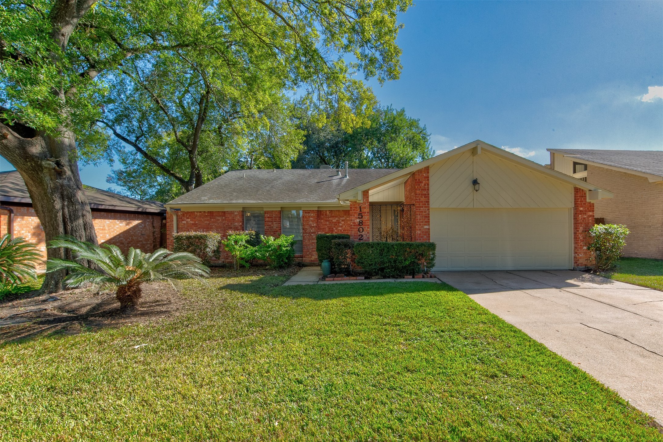 15802 Mill Point Drive Houston, TX 77059 - Photo 1 of 23 a front view of a house with garden