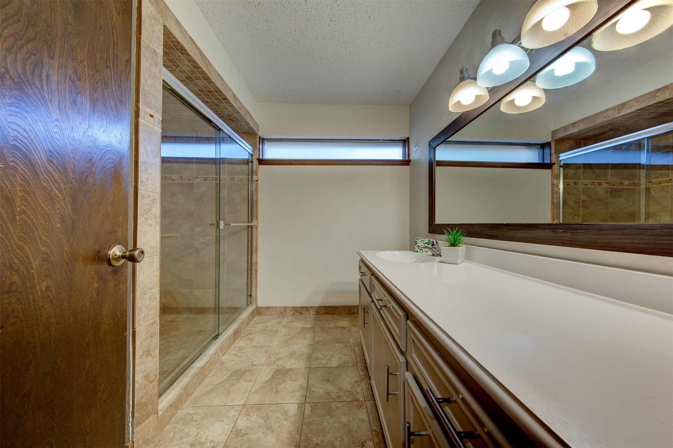 15802 Mill Point Drive Houston, TX 77059 - Photo 16 of 23 a bathroom with a sink and a mirror