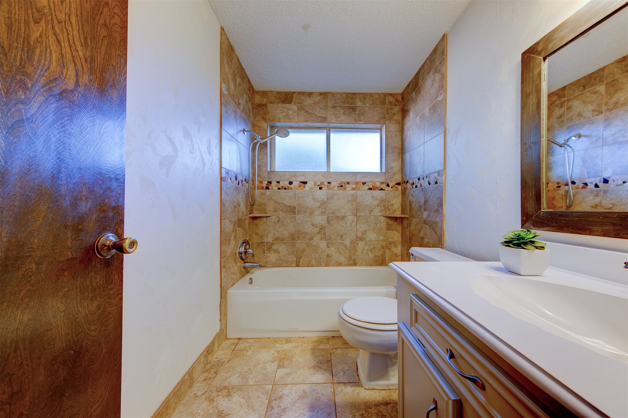 15802 Mill Point Drive Houston, TX 77059 - Photo 18 of 23 a bathroom with a granite countertop bathtub sink and toilet