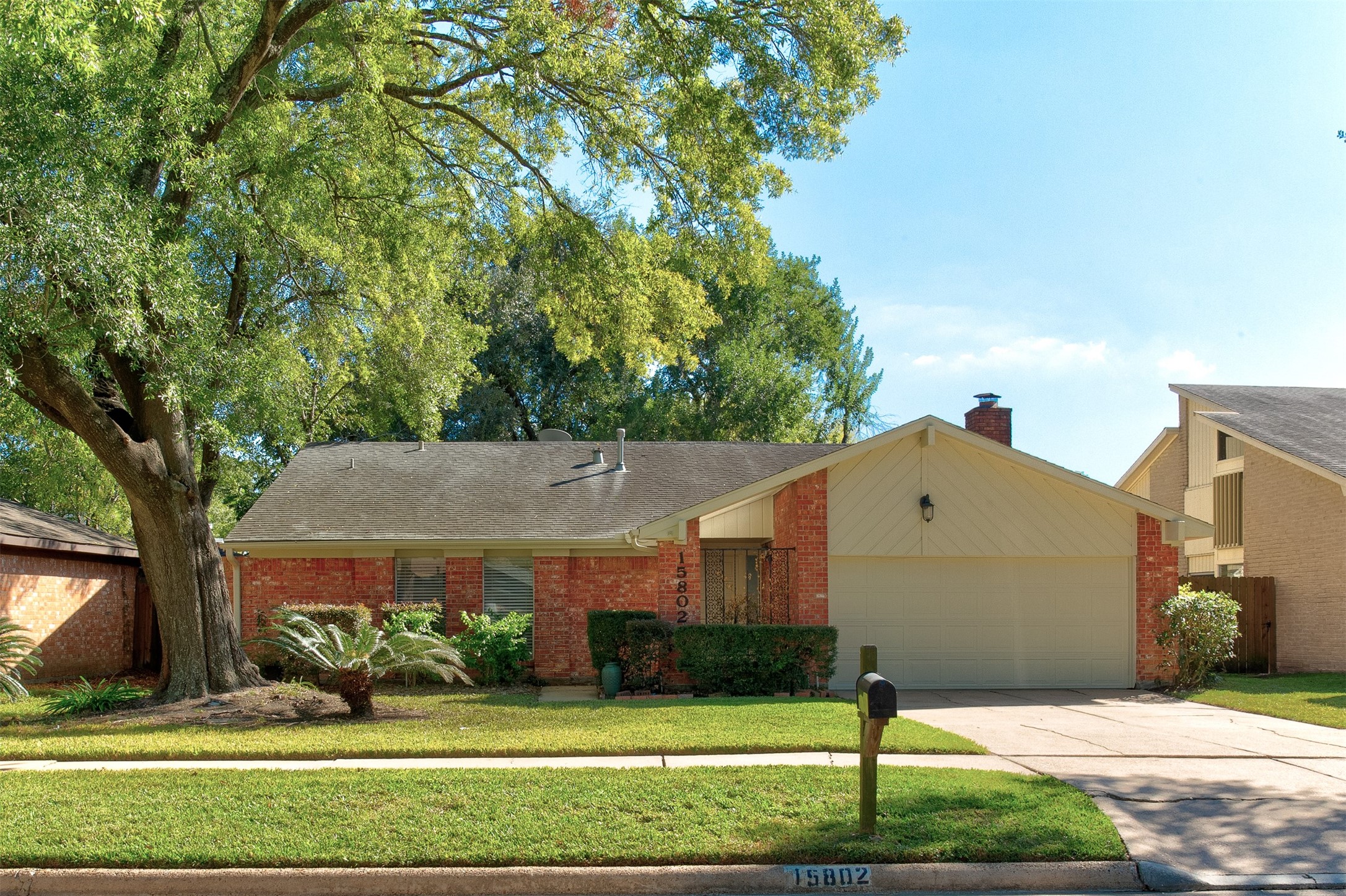 15802 Mill Point Drive Houston, TX 77059 - Photo 2 of 23 a front view of a house with garden