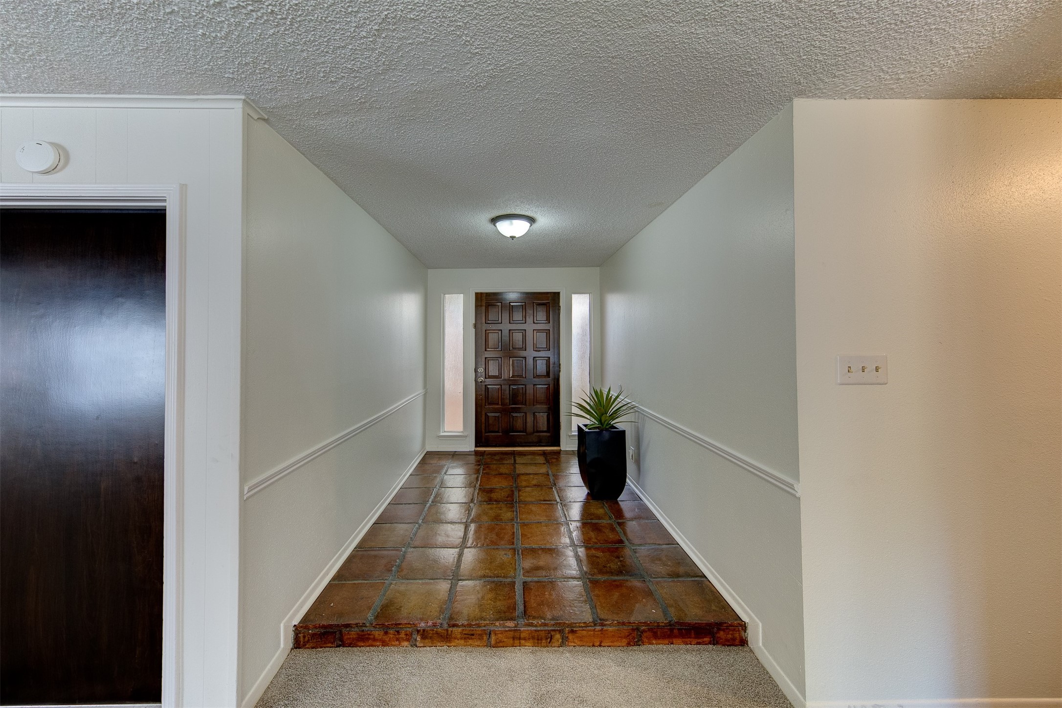 15802 Mill Point Drive Houston, TX 77059 - Photo 3 of 23 a view of hallway with wooden floor