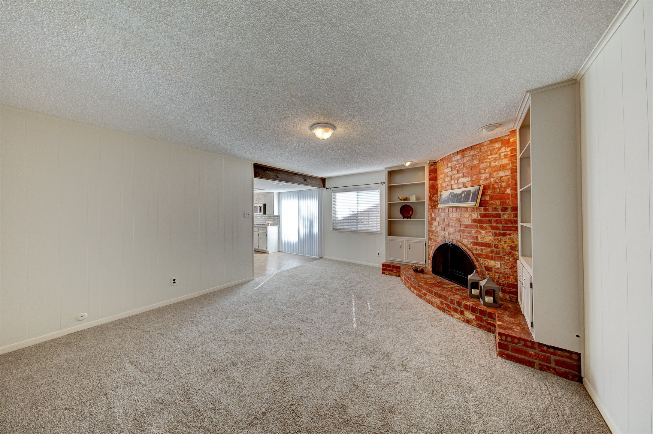 15802 Mill Point Drive Houston, TX 77059 - Photo 6 of 23 a view of an empty room with a fireplace and a window