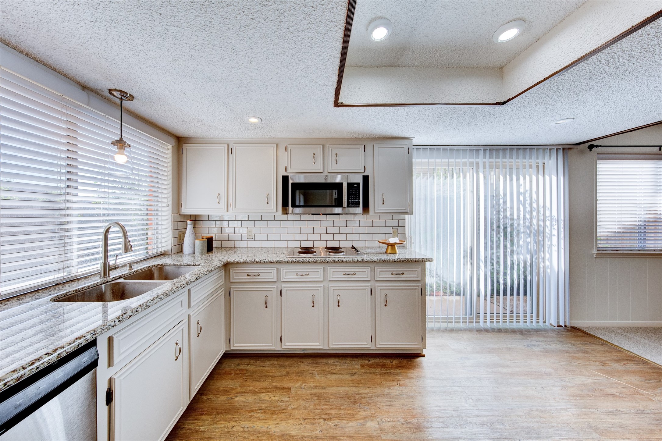 15802 Mill Point Drive Houston, TX 77059 - Photo 8 of 23 a kitchen with granite countertop a sink stainless steel appliances a counter space and cabinets