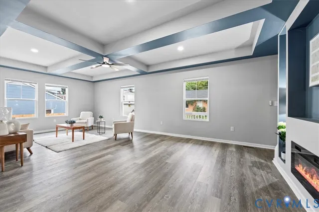 a view of a livingroom with furniture and a flat screen tv