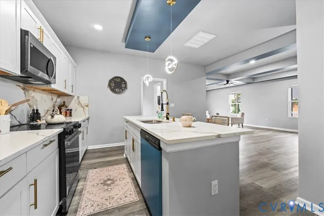 a kitchen with a sink and stove