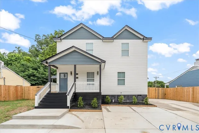a front view of a house with yard