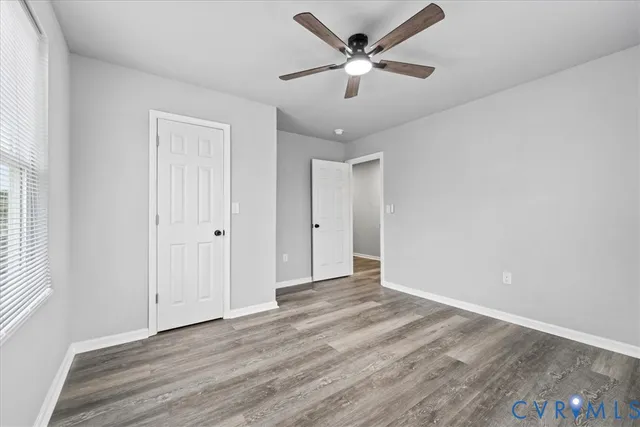 a bathroom with a sink toilet mirror vanity and bathtub