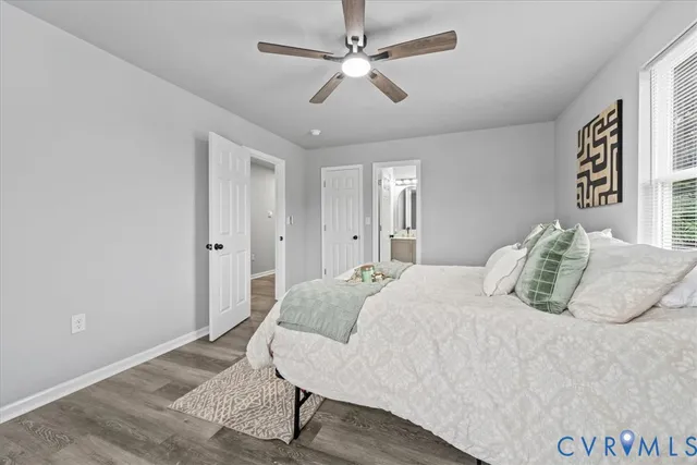 a bedroom with a large bed closet and a window