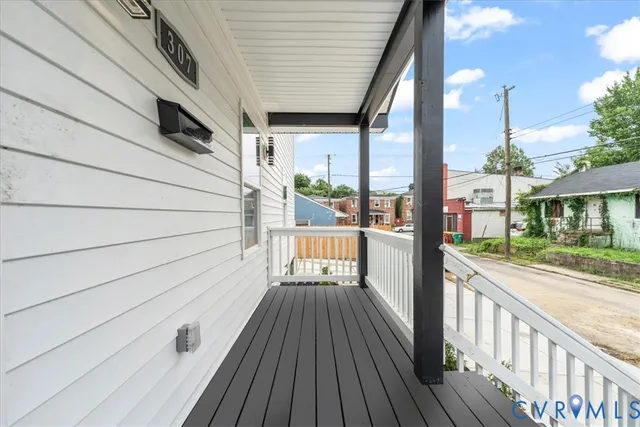 a view of a balcony with wooden floor