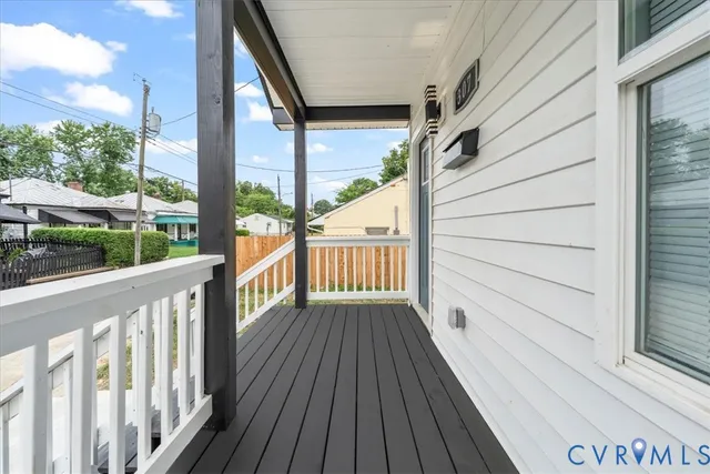 a view of a balcony with wooden floor