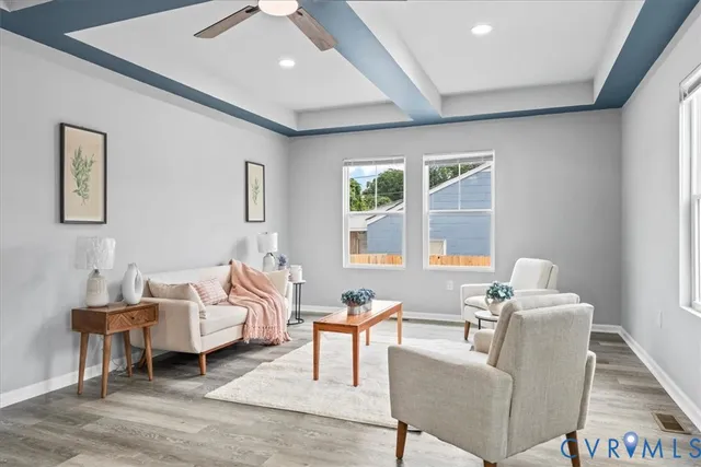 a living room with furniture and a large window