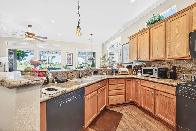 a kitchen with sink cabinets and window