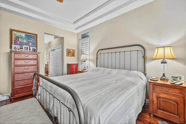 a bedroom with a bed and a dresser