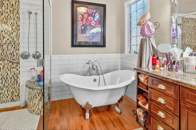a living room with furniture window and wooden floor
