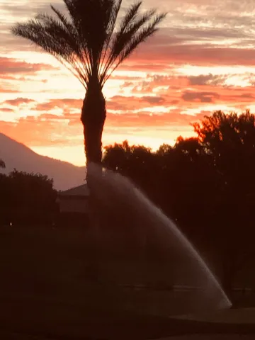 a room with furniture pool table and windows