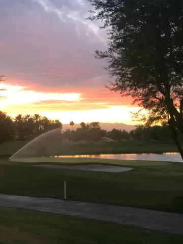 a view of a chairs and table in patio