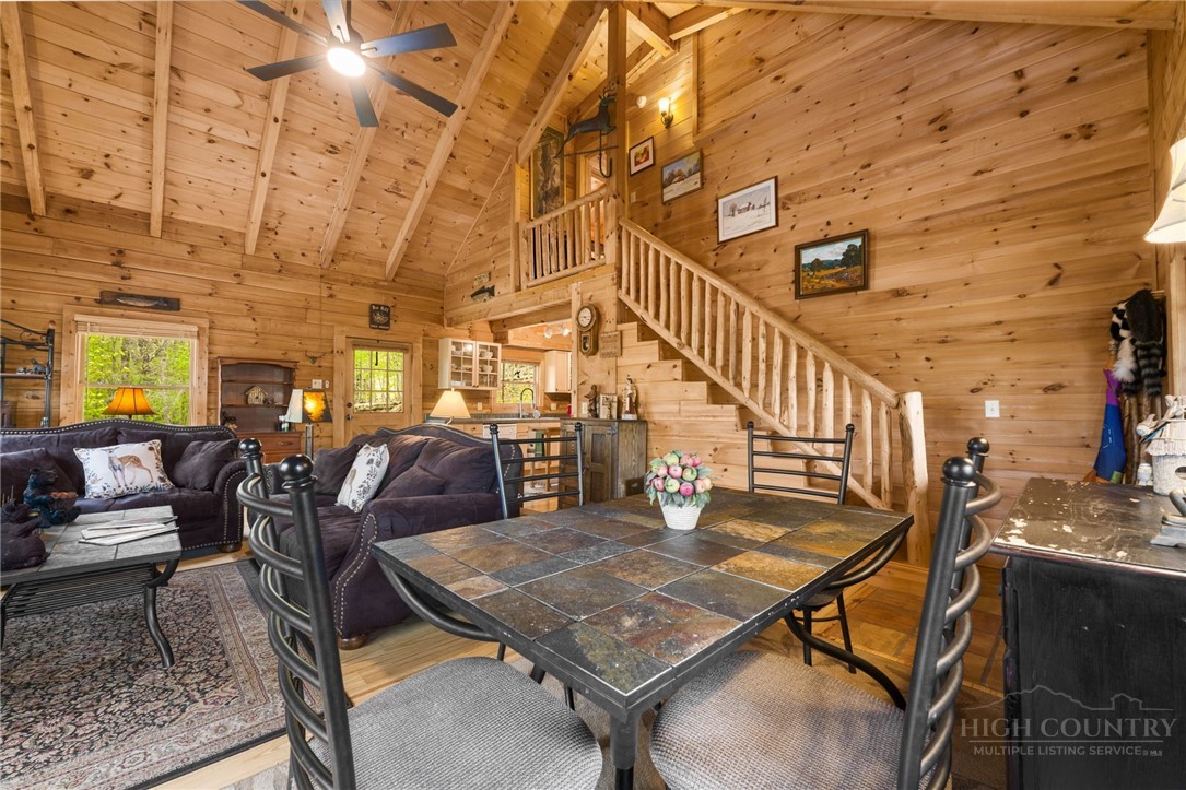 259 Greenbriar Road Beech Mountain, NC 28604 - Photo 19 of 41 a dining room with lots of chairs and a projector screen
