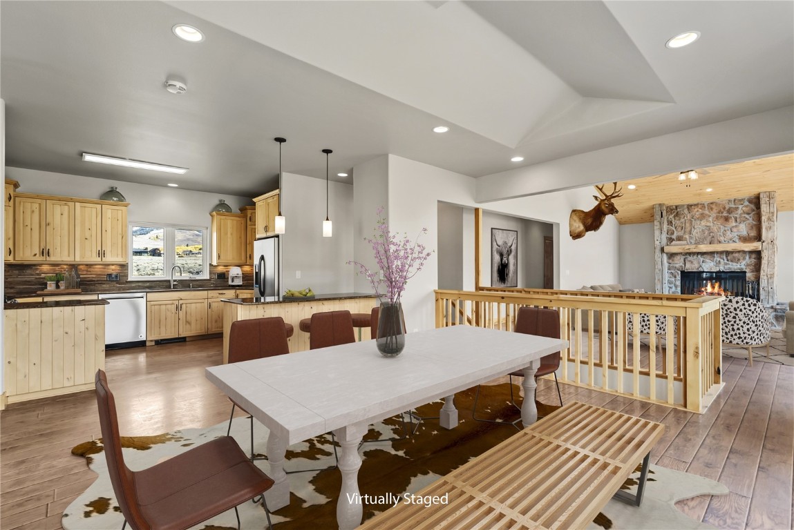 845 Elk Run Road Silverthorne, CO 80498 - Photo 16 of 50 a view of a dining room with furniture