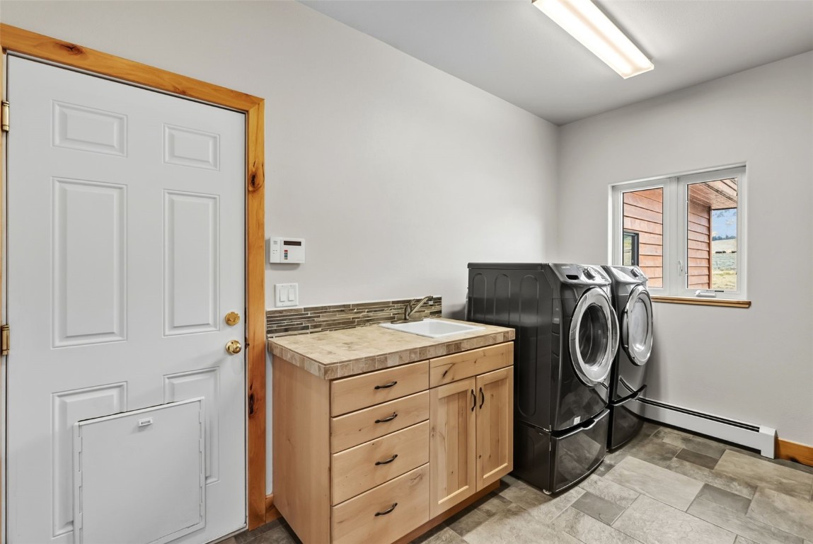 845 Elk Run Road Silverthorne, CO 80498 - Photo 25 of 50 a utility room with dryer and washer