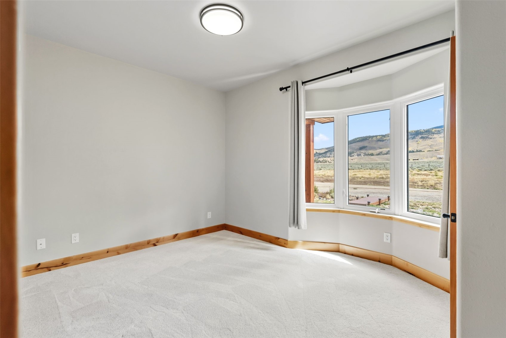 845 Elk Run Road Silverthorne, CO 80498 - Photo 29 of 50 a view of an empty room with a window