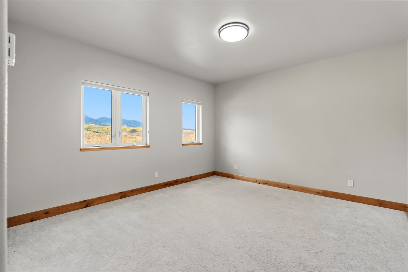 845 Elk Run Road Silverthorne, CO 80498 - Photo 38 of 50 an empty room with windows