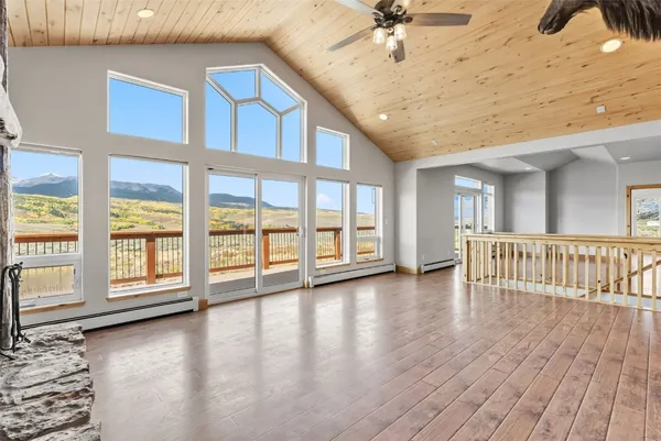 a view of an entryway with wooden floor