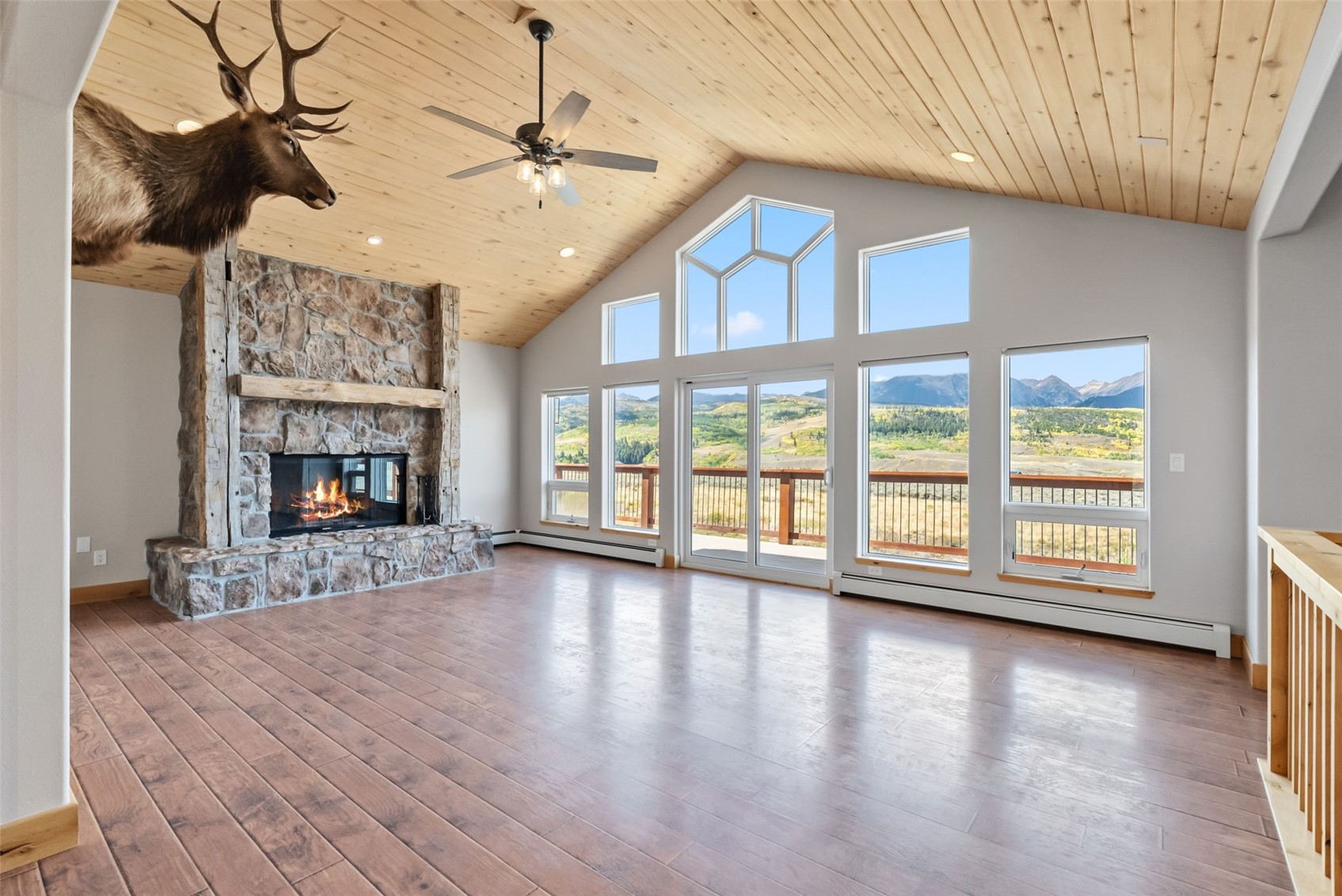 845 Elk Run Road Silverthorne, CO 80498 - Photo 9 of 50 a view of an empty room with a window and fireplace
