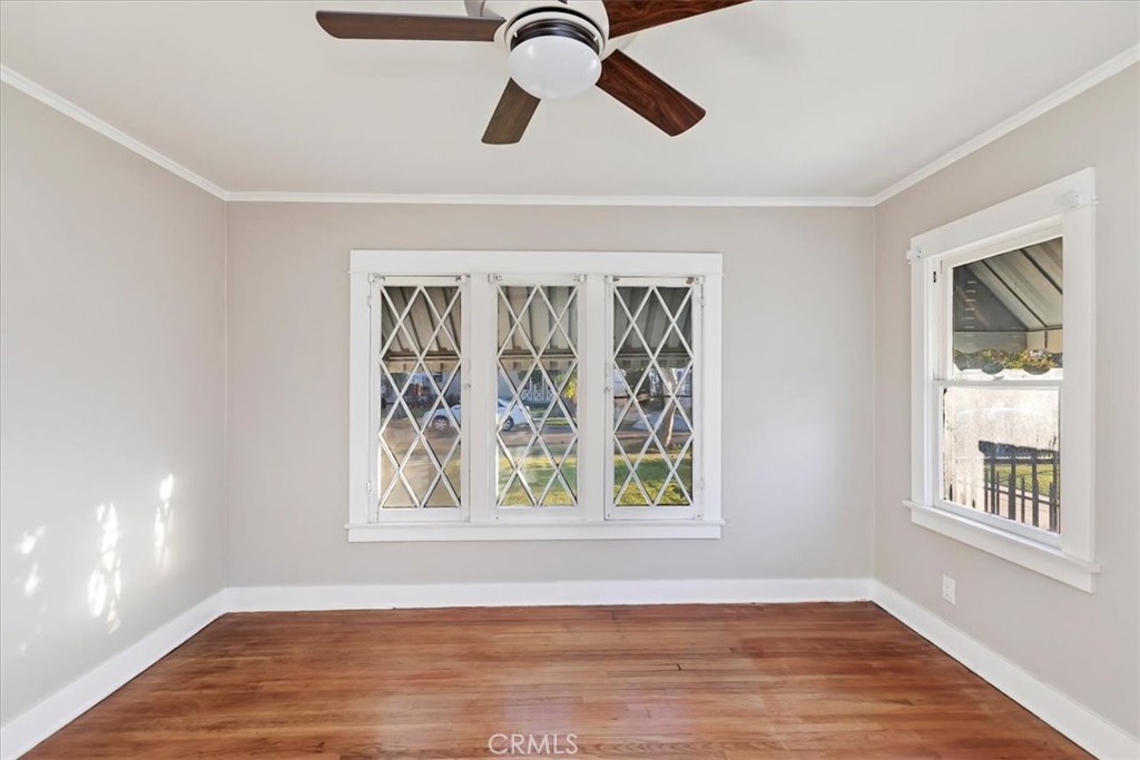 4311 Sunnyside Drive Riverside, CA 92506 - Photo 24 of 40 a view of an empty room with a window and wooden floor
