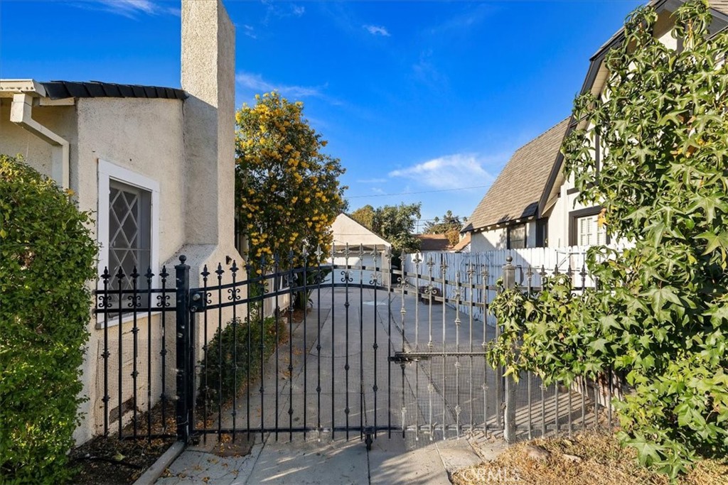 4311 Sunnyside Drive Riverside, CA 92506 - Photo 28 of 40 a view of a house with a flower garden
