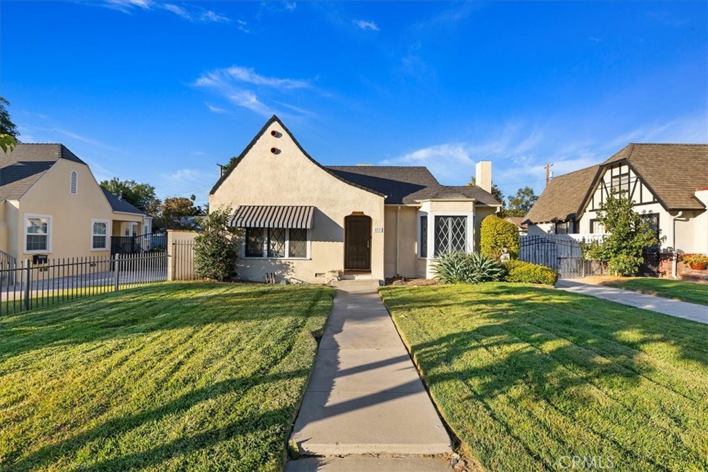 4311 Sunnyside Drive Riverside, CA 92506 - Photo 5 of 40 a front view of a house with a yard
