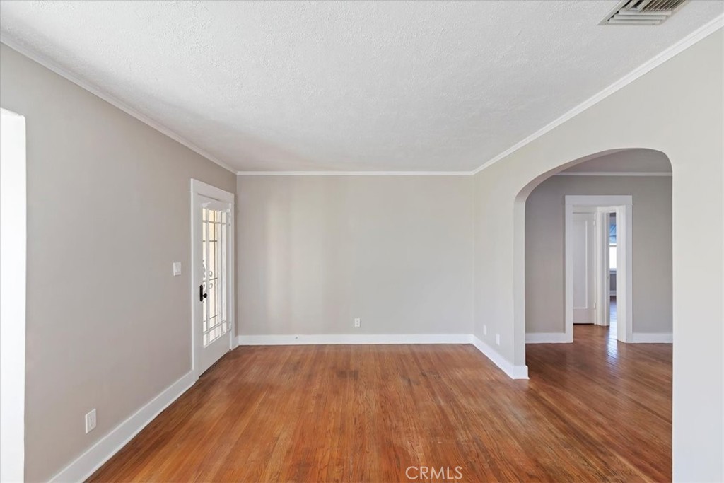 4311 Sunnyside Drive Riverside, CA 92506 - Photo 10 of 40 an empty room with wooden floor and windows