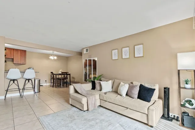 a living room with furniture and a table