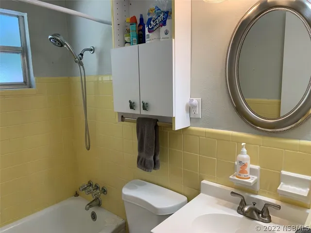 a bathroom with a sink and toilet