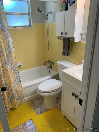 a kitchen with stainless steel appliances a stove a sink and a refrigerator