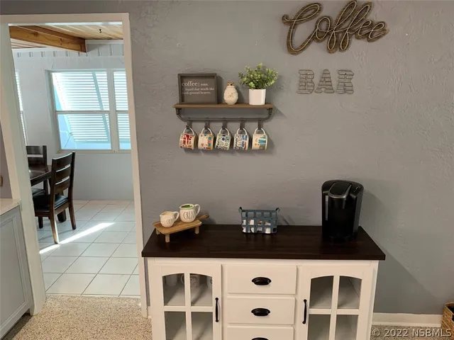 a kitchen with a sink stove and refrigerator