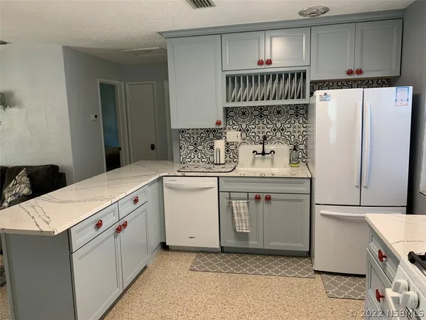 a view of a livingroom with wooden floor