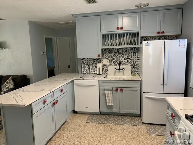 a view of a livingroom with wooden floor