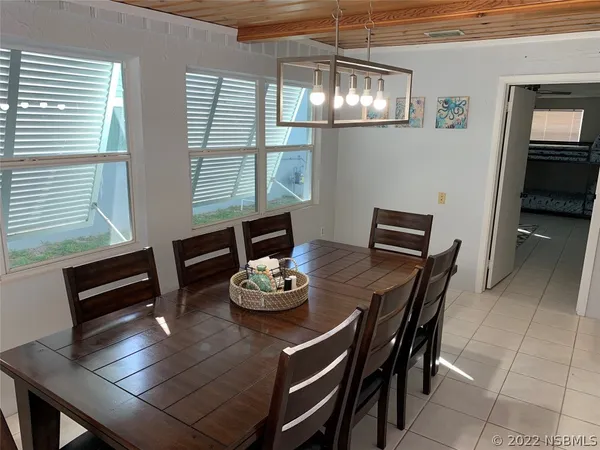 a kitchen with a refrigerator and a sink